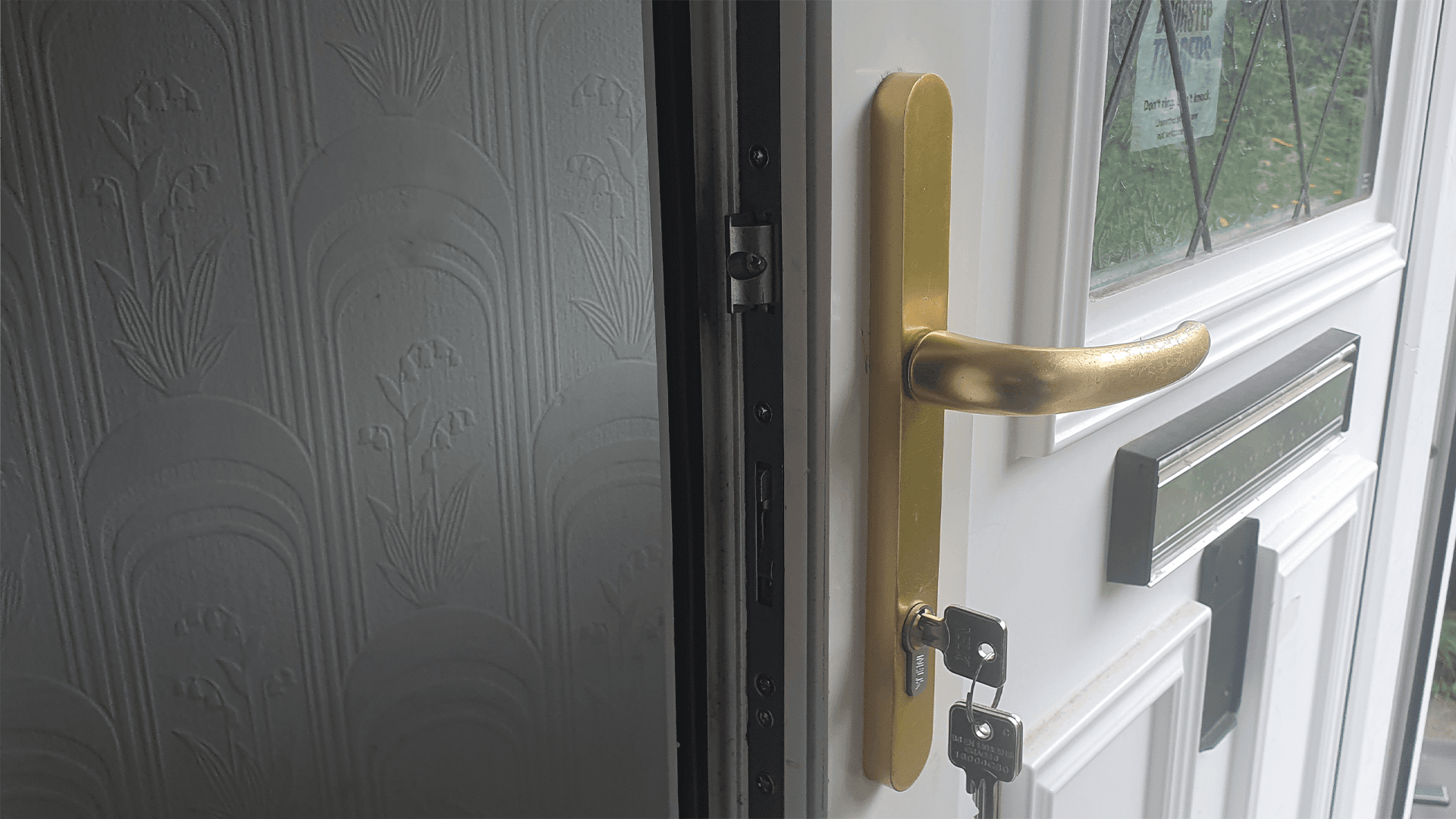 Professional locksmith in Newcastle installing a SAFEWARE strip on a door that had been left unsecured