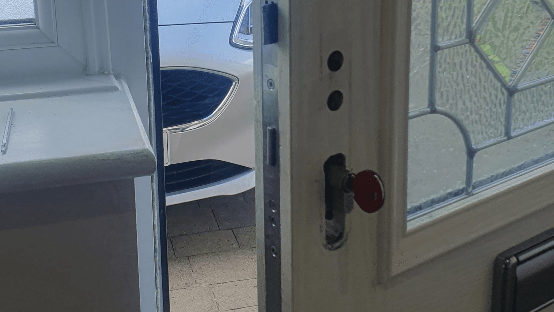Locksmith using specialised tools to manipulate jammed bolt mechanism