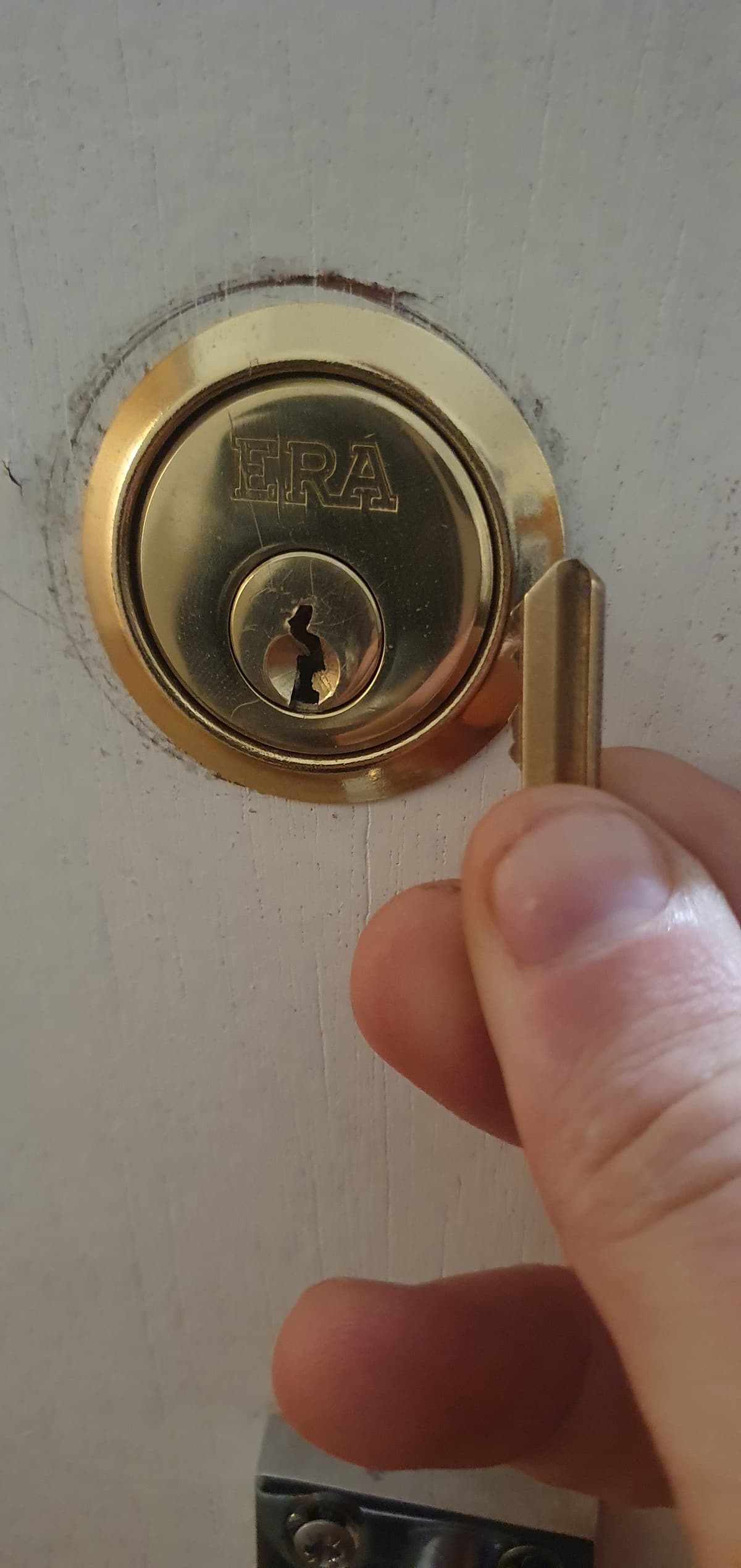 A broken lock with a key snapped