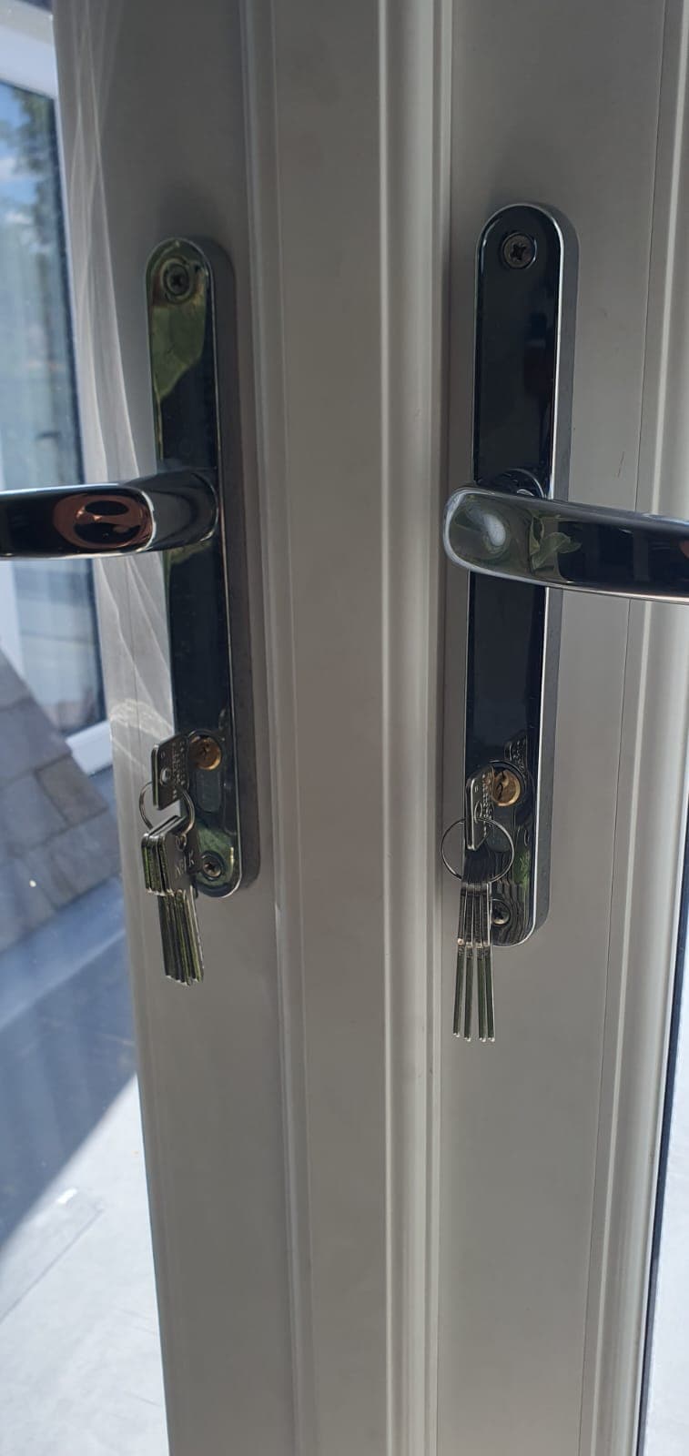 Black lever handles and euro cylinders fitted to uPVC French doors