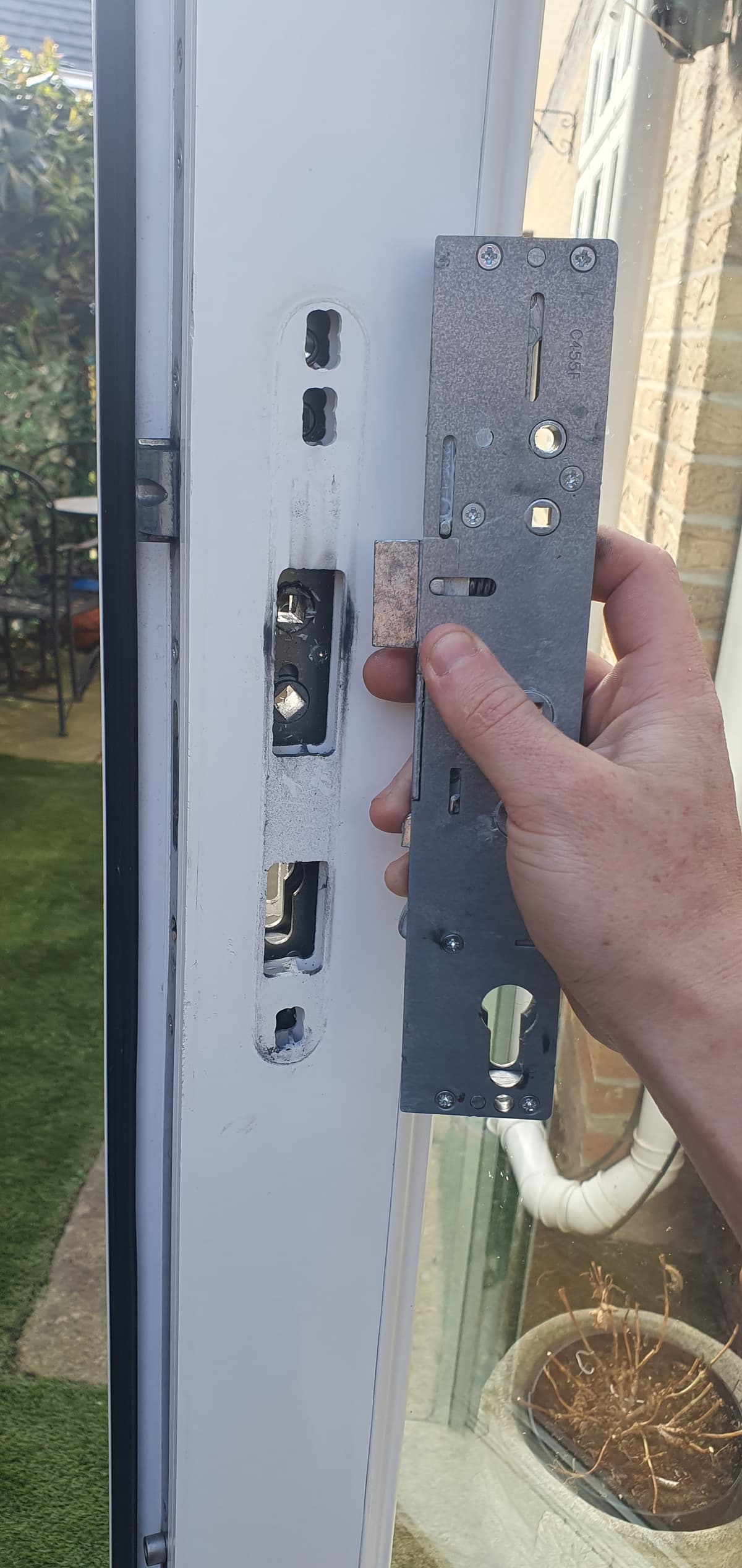 A broken lock mechanisim on a door repair