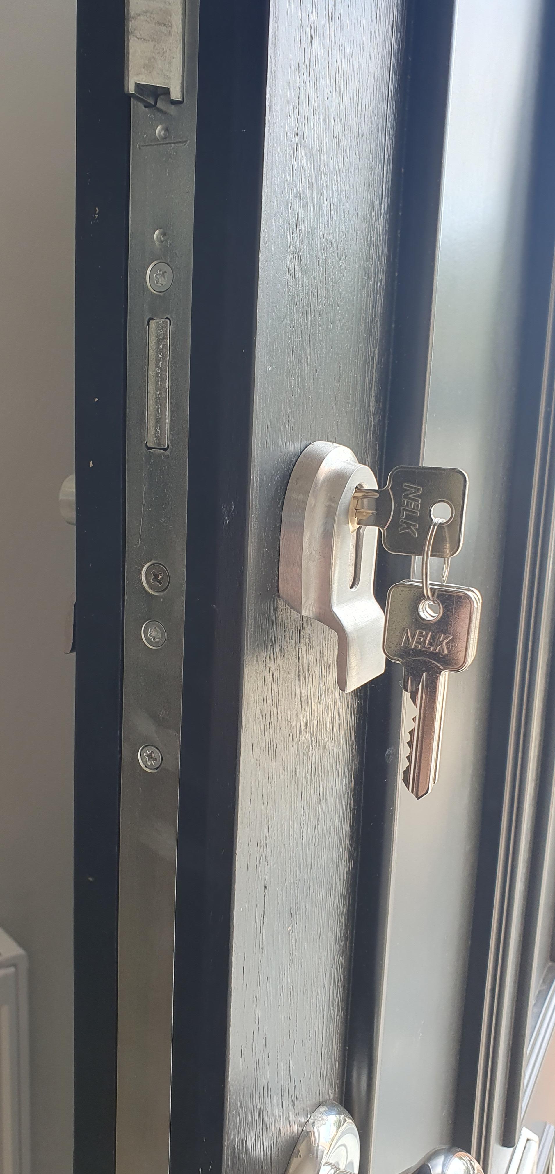 A residential door unlocked by AD Locksmithing