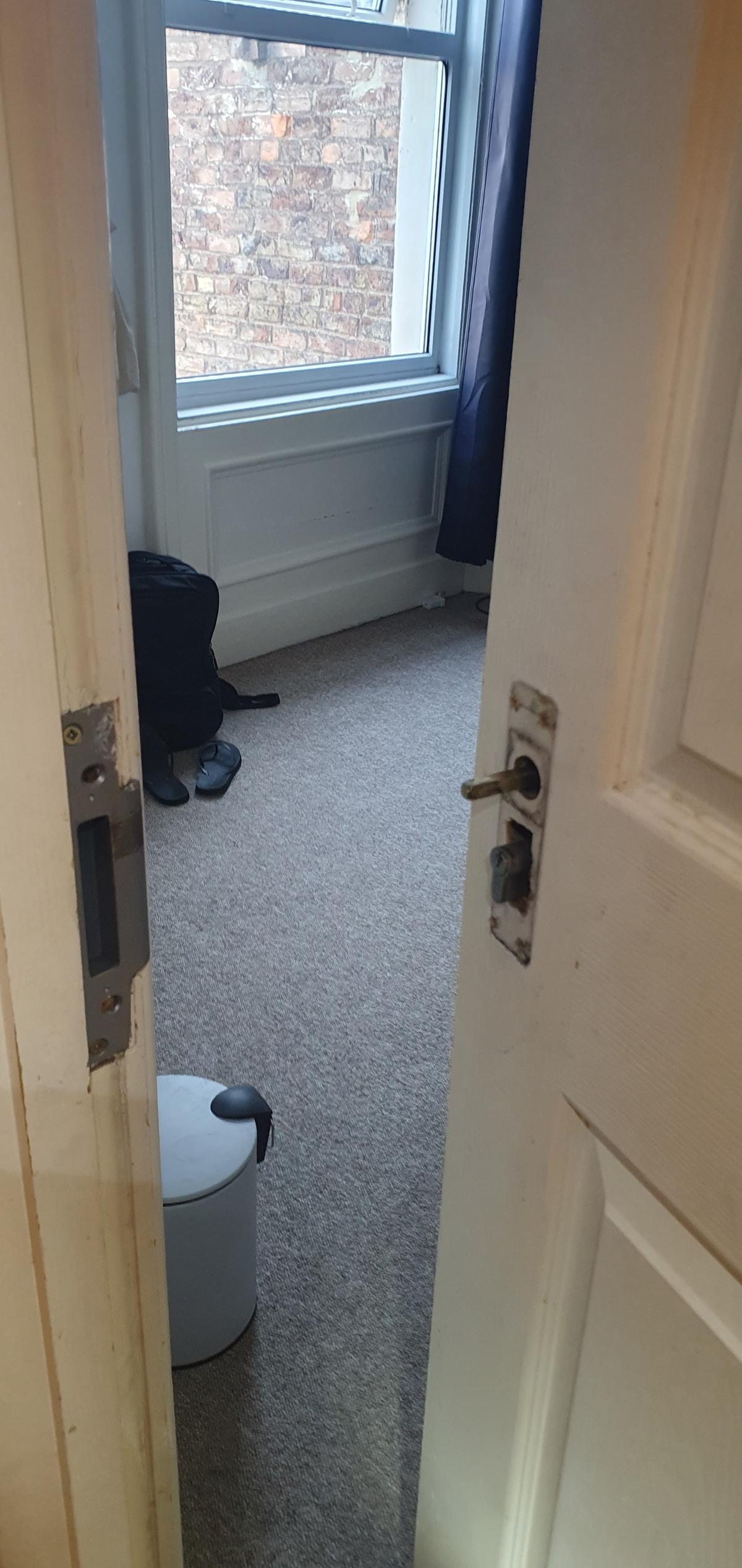 A door with a lock changing too being used