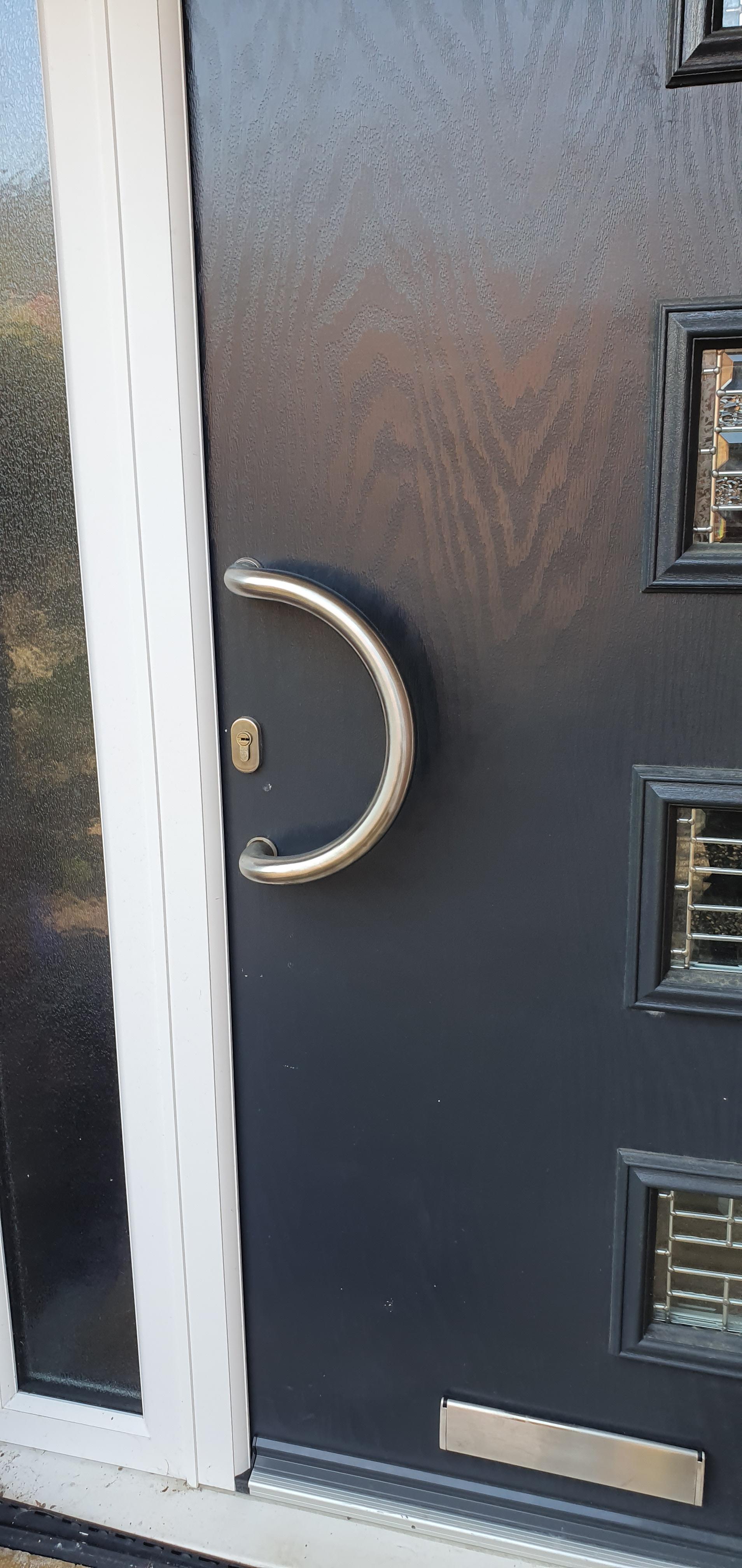 A residential door with a broken handle